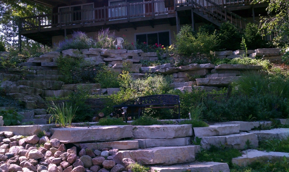 Segmented retaining walls create an organic look to Waterford home